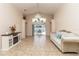 Bright living room features tiled floors, vaulted ceilings, and access to the outdoor patio at 162 Seneca Point Trl, Kissimmee, FL 34746