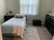 Bedroom with bright window and dresser at 4183 Cortland Dr, Davenport, FL 33837