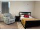 Cozy bedroom featuring a comfortable recliner and well-lit window at 4183 Cortland Dr, Davenport, FL 33837
