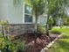 This home features lush landscaping with vibrant plants, mulch and green grass, enhancing its curb appeal at 4183 Cortland Dr, Davenport, FL 33837