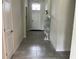 Clean and spacious hallway with neutral tile floors and natural light at 4183 Cortland Dr, Davenport, FL 33837
