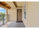 Private balcony with railing and a view of lush greenery, perfect for relaxing at 2217 Grand Cayman Ct # 1233, Kissimmee, FL 34741