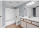 Bright bathroom featuring a shower-tub combo, modern vanity, and neutral tile floors at 2217 Grand Cayman Ct # 1233, Kissimmee, FL 34741