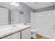 Bathroom featuring a vanity, mirror, toilet, and a shower-tub combo, offering essential amenities at 2217 Grand Cayman Ct # 1233, Kissimmee, FL 34741