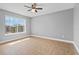 Bedroom featuring a ceiling fan, neutral walls, tile floor and a window offering outdoor views at 2217 Grand Cayman Ct # 1233, Kissimmee, FL 34741