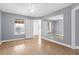 Spacious bedroom with tile floors, abundant natural light, and mirrored wall accent at 2217 Grand Cayman Ct # 1233, Kissimmee, FL 34741