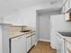 Modern kitchen features white cabinets, countertops, and appliances including refrigerator and dishwasher at 2217 Grand Cayman Ct # 1233, Kissimmee, FL 34741