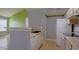 Kitchen featuring white appliances, tile flooring, and bar seating area at 2217 Grand Cayman Ct # 1233, Kissimmee, FL 34741