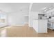 Bright living room featuring vaulted ceilings, and an open layout connecting the kitchen and a large window at 2217 Grand Cayman Ct # 1233, Kissimmee, FL 34741