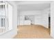 Open concept living room with kitchen, tile floors, neutral walls, and natural light at 2217 Grand Cayman Ct # 1233, Kissimmee, FL 34741