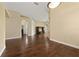 Open-concept living room with hardwood floors, archways, neutral colors and a ceiling fan at 3222 Stonehurst Cir, Kissimmee, FL 34741