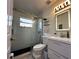Bathroom with a glass shower and a white vanity illuminated by a modern light fixture at 5906 Rywood Dr, Orlando, FL 32810