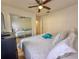 Bedroom with mirrored closet doors and a window creating a more spacious feel at 5906 Rywood Dr, Orlando, FL 32810