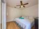 Bedroom with light walls, wood floor, and a ceiling fan for added comfort at 5906 Rywood Dr, Orlando, FL 32810