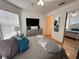 Bedroom with a ceiling fan, stylish decor, and natural light from the windows and mirror at 5906 Rywood Dr, Orlando, FL 32810
