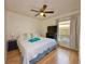 Cozy bedroom with ceiling fan, window, and wood floors provides natural light at 5906 Rywood Dr, Orlando, FL 32810