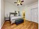 Well-lit bedroom with hardwood floors and a king-size bed, complemented by tasteful decor and ample space at 5906 Rywood Dr, Orlando, FL 32810