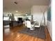 The dining room has wood floors, a glass table with white chairs, and opens to the kitchen at 5906 Rywood Dr, Orlando, FL 32810