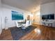Bright dining room features a glass table, white chairs, and decor on wood floors at 5906 Rywood Dr, Orlando, FL 32810