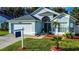 Beautiful single-Gathering home with tidy landscaping and inviting front entrance at 5906 Rywood Dr, Orlando, FL 32810