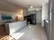 Bright kitchen featuring a large island with granite counters and stainless steel appliances, open to the dining area at 5906 Rywood Dr, Orlando, FL 32810