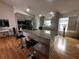 Modern kitchen featuring granite countertops, stainless steel appliances, and a convenient breakfast bar with seating at 5906 Rywood Dr, Orlando, FL 32810