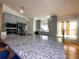 Close-up of the kitchen island featuring granite countertops, and seating, with natural light from the window at 5906 Rywood Dr, Orlando, FL 32810