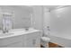 Stylish bathroom with a double vanity, tub-shower combination, and sleek fixtures for a modern, clean look at 1647 Sugarbelle Cir, Mascotte, FL 34753