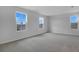 Airy bedroom featuring neutral walls, plush carpet, and multiple windows providing ample natural light at 1647 Sugarbelle Cir, Mascotte, FL 34753