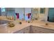 Bright bathroom featuring double sinks, a large mirror, and ample counter space at 9549 Sw 53Rd Cir, Ocala, FL 34476