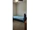 Minimalist bedroom featuring neutral walls, carpet flooring, and a simple desk at 9549 Sw 53Rd Cir, Ocala, FL 34476
