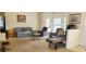 Inviting living room with ample seating, natural light, and an open layout at 9549 Sw 53Rd Cir, Ocala, FL 34476