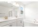 Bathroom boasts double sinks, a soaking tub, and a walk-in shower at 4212 Sawtooth Ct, Tavares, FL 32778