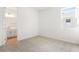 Spacious bedroom with an ensuite bathroom and neutral wall colors at 4212 Sawtooth Ct, Tavares, FL 32778