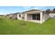 View of house exteriors showcasing multiple homes with backyard space at 4212 Sawtooth Ct, Tavares, FL 32778