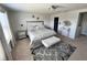 Elegant bedroom suite featuring a plush bed, stylish decor, and ample natural light at 8118 Platts Ave, Orlando, FL 32832