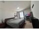 Bedroom with guitar decorations and work desk at 8118 Platts Ave, Orlando, FL 32832