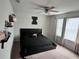 Bedroom with fan, window, and neutral carpet at 8118 Platts Ave, Orlando, FL 32832