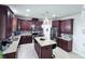 Well-equipped kitchen features stainless appliances, granite counters, and convenient island at 8118 Platts Ave, Orlando, FL 32832