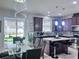 Modern kitchen with stainless appliances, granite counters and eat in dining area at 8118 Platts Ave, Orlando, FL 32832