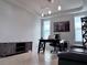 Well-lit office featuring a sleek black desk, comfortable leather couch, and ample storage at 8118 Platts Ave, Orlando, FL 32832