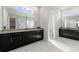 Modern bathroom with double vanity and marble flooring at 107 Hampton Loop, Davenport, FL 33837