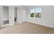 Bright bedroom featuring tile floors, a large window for natural light, and neutral paint at 107 Hampton Loop, Davenport, FL 33837