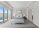 Bright and airy bedroom with a sliding glass door that leads to the pool and spa at 107 Hampton Loop, Davenport, FL 33837