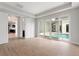 Bright bedroom with pool view and access to a modern bathroom at 107 Hampton Loop, Davenport, FL 33837