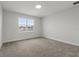 Simple bedroom with carpeted floor and window at 107 Hampton Loop, Davenport, FL 33837