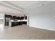 Modern kitchen with island and stainless steel appliances at 107 Hampton Loop, Davenport, FL 33837