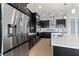 Modern kitchen with stainless steel appliances and white countertops at 107 Hampton Loop, Davenport, FL 33837