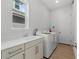 Laundry room with washer, dryer, and utility sink at 107 Hampton Loop, Davenport, FL 33837