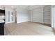 Bright living room with built-in shelving and tile floors at 107 Hampton Loop, Davenport, FL 33837